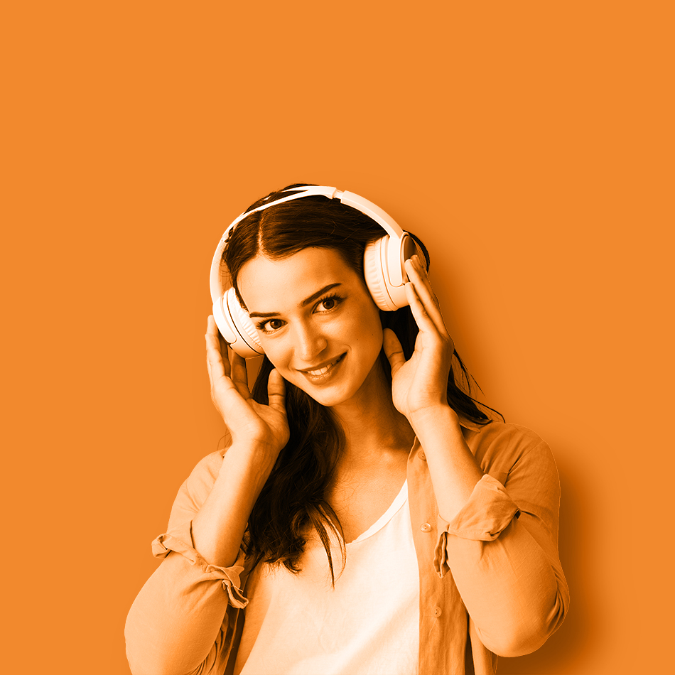 Beautiful,Smiling,Young,Woman,Wearing,Wireless,Headphones,And,Looking,At